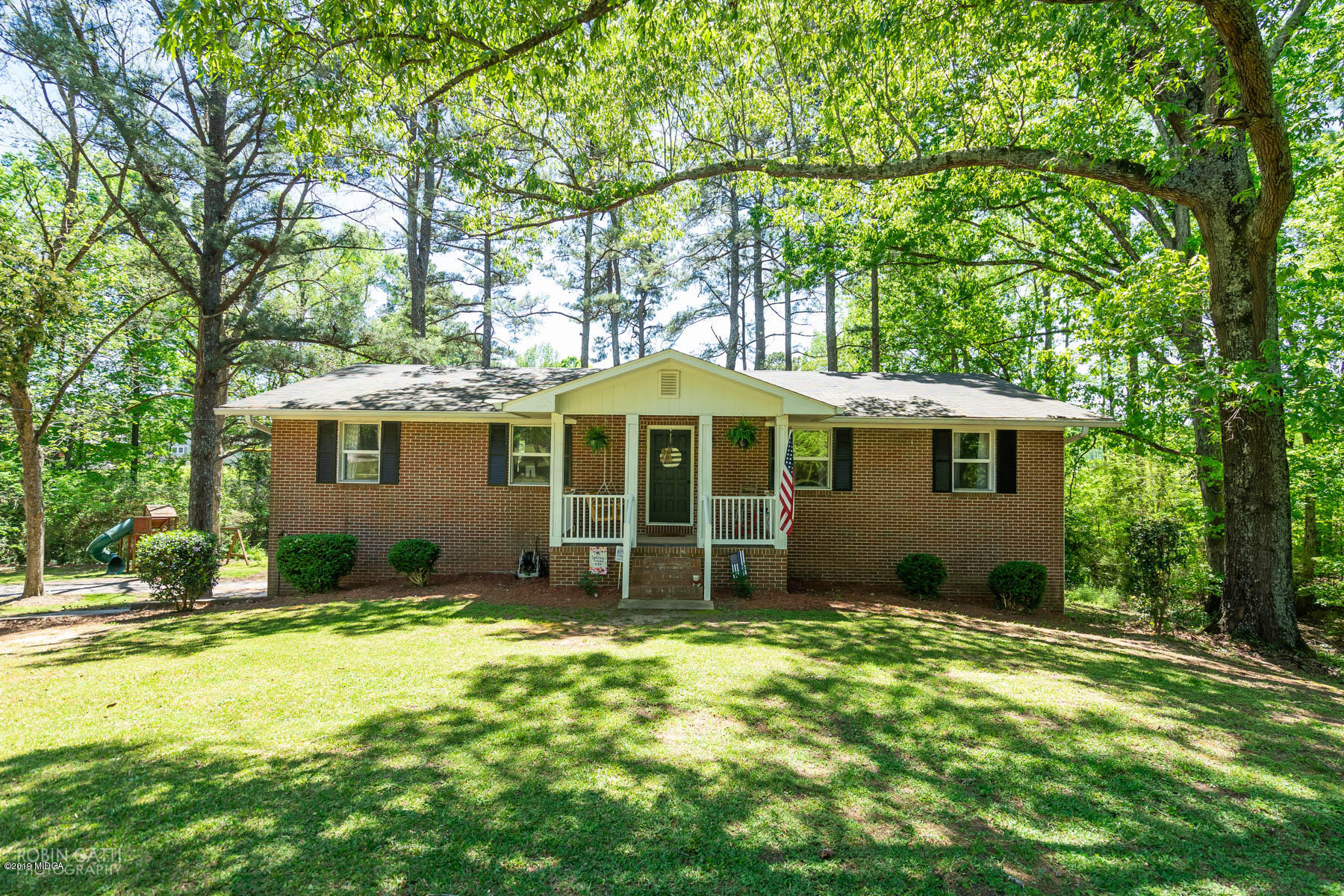 1613 Dames Ferry Road Forsyth, GA 31029 - Photo 1 of 23 a view of a house with a yard