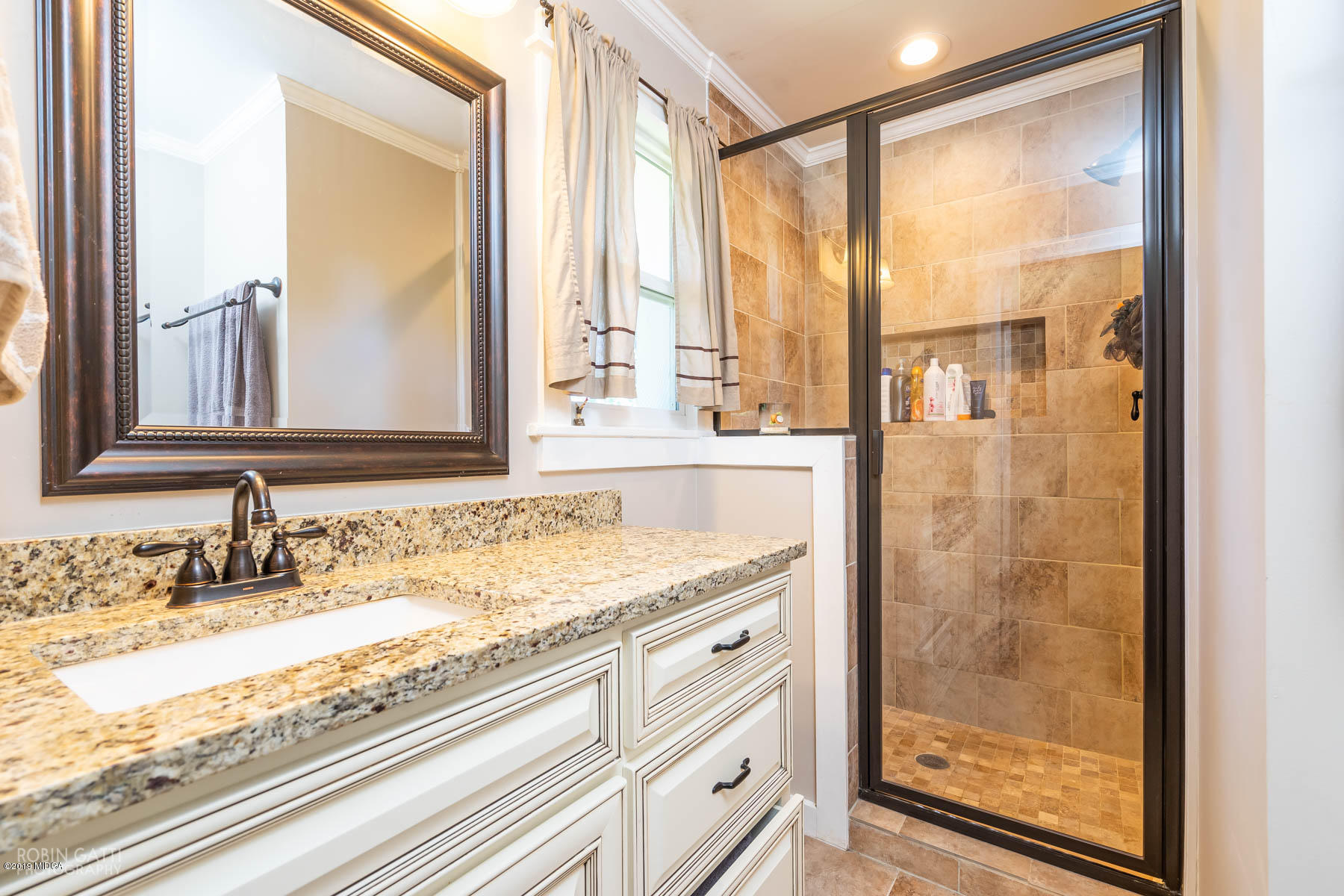 1613 Dames Ferry Road Forsyth, GA 31029 - Photo 13 of 23 a bathroom with a granite countertop sink and a mirror