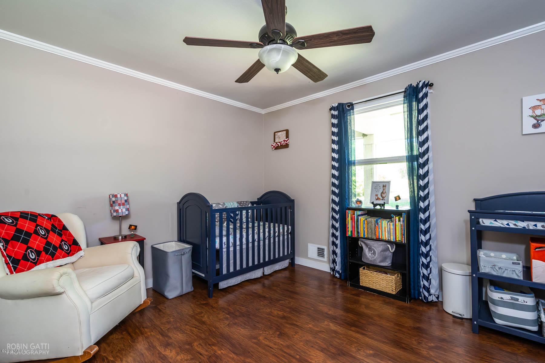 1613 Dames Ferry Road Forsyth, GA 31029 - Photo 14 of 23 a bedroom with furniture and a window