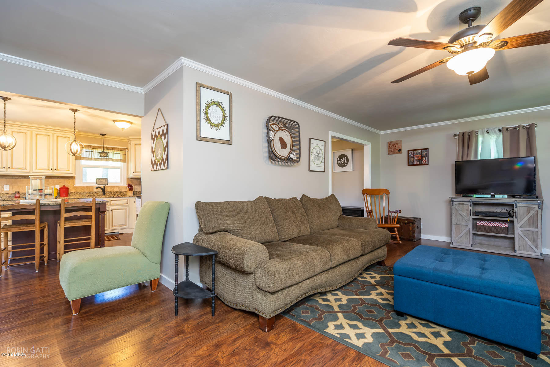 1613 Dames Ferry Road Forsyth, GA 31029 - Photo 3 of 23 a living room with furniture and a flat screen tv