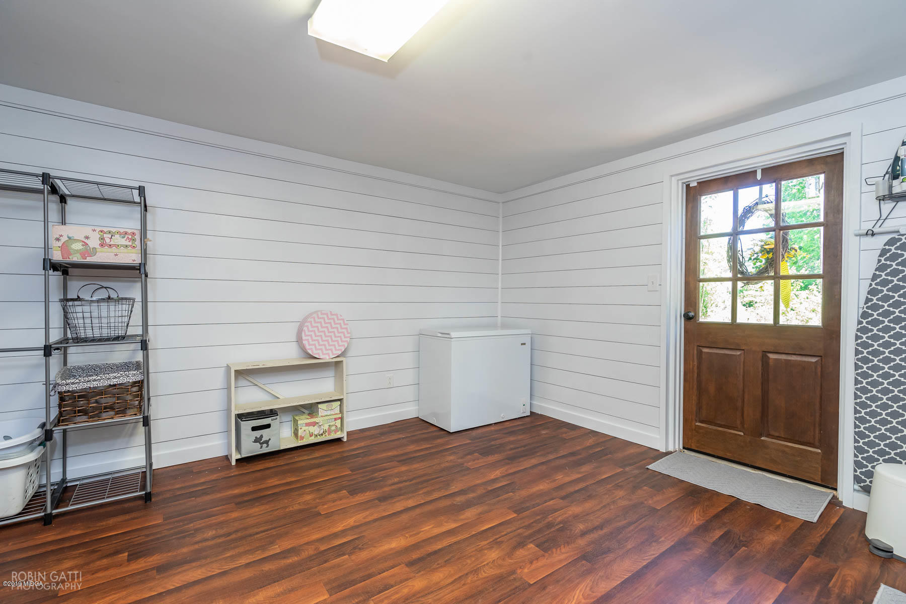 1613 Dames Ferry Road Forsyth, GA 31029 - Photo 21 of 23 a view of empty room with wooden floor and fan