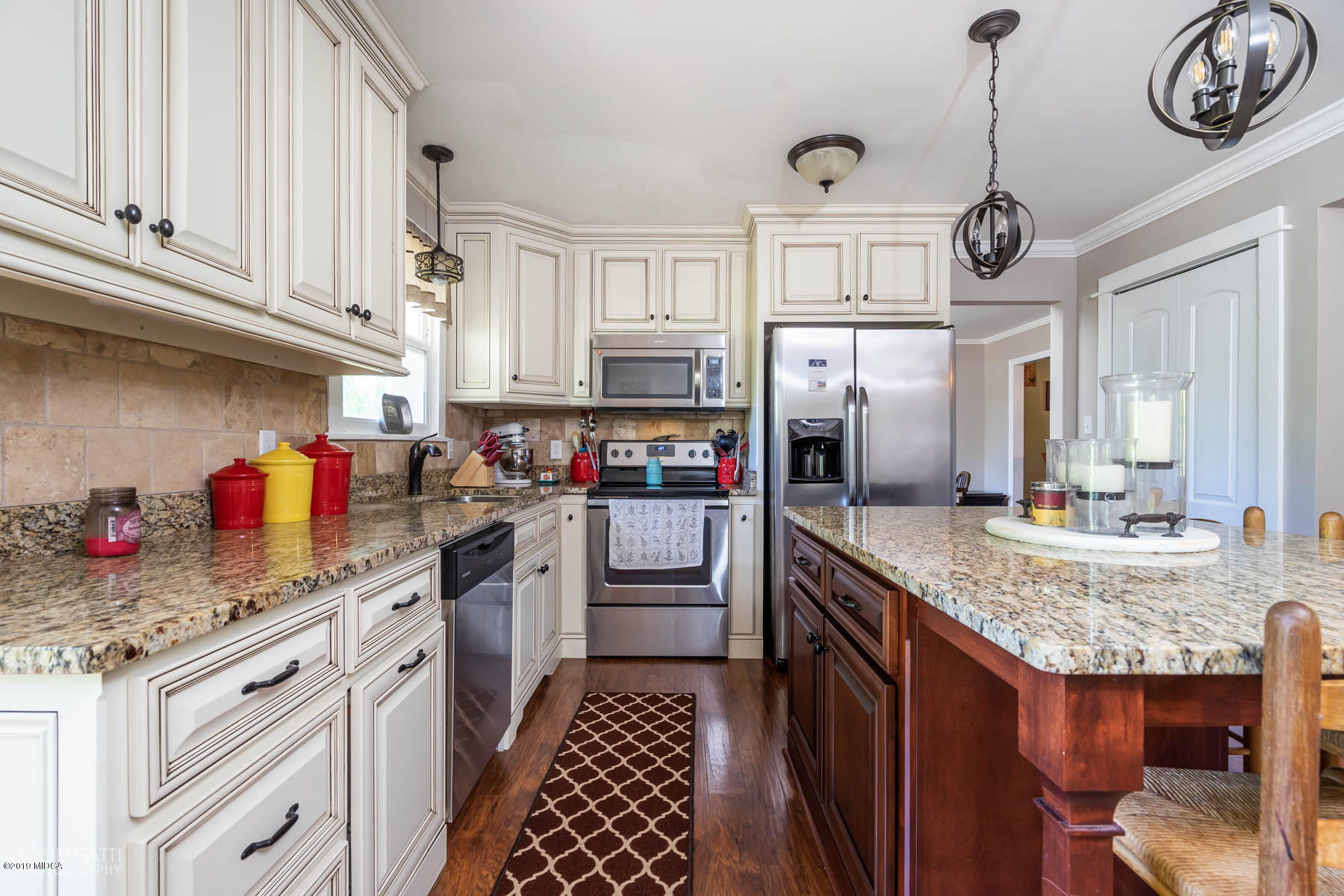 1613 Dames Ferry Road Forsyth, GA 31029 - Photo 8 of 23 a kitchen with stainless steel appliances granite countertop a sink dishwasher stove and cabinets