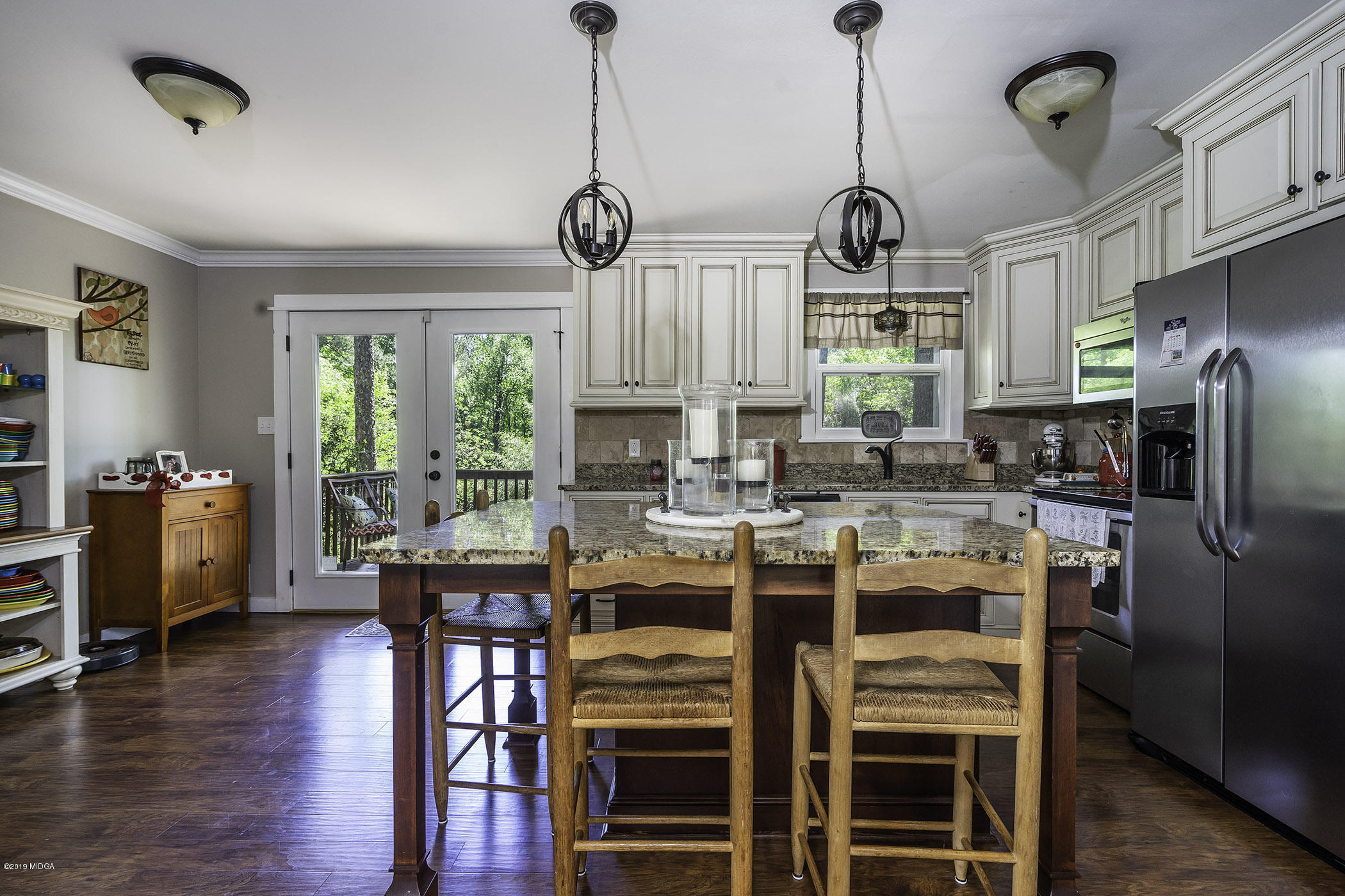 1613 Dames Ferry Road Forsyth, GA 31029 - Photo 9 of 23 a view of a dining room with furniture window and wooden floor