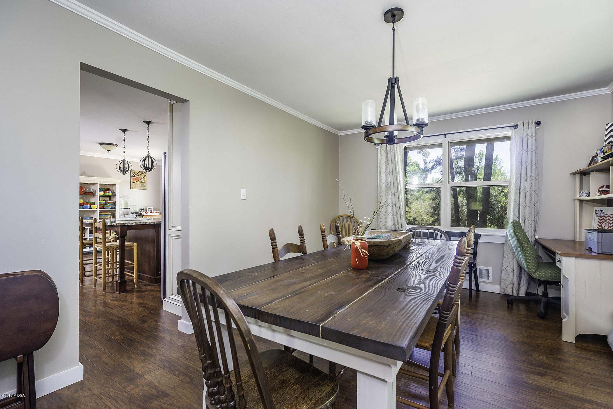 1613 Dames Ferry Road Forsyth, GA 31029 - Photo 10 of 23 a view of a dining room with furniture window and wooden floor