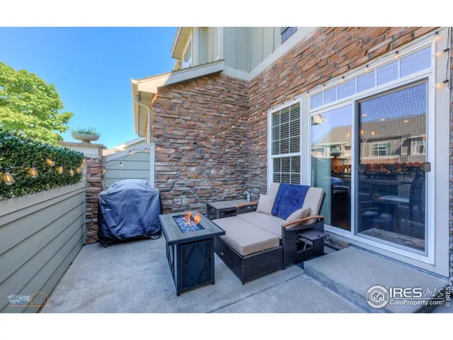 a backyard of a house with outdoor seating