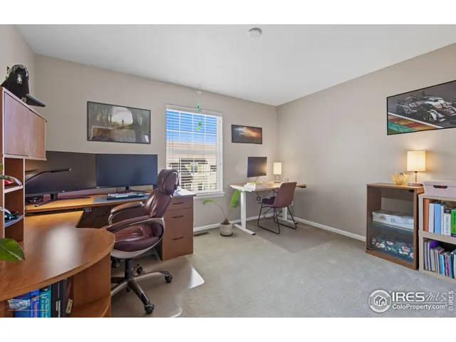 a workspace with furniture and a window