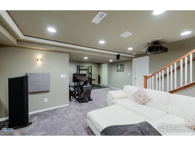 a bedroom with furniture and a ceiling fan