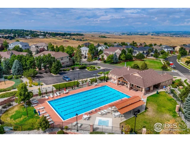 an aerial view of a tennis ground and lake view