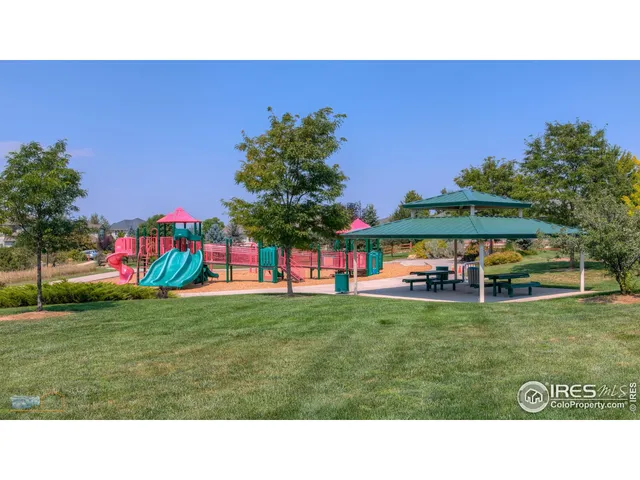 a childrens park with lots of swings and slides