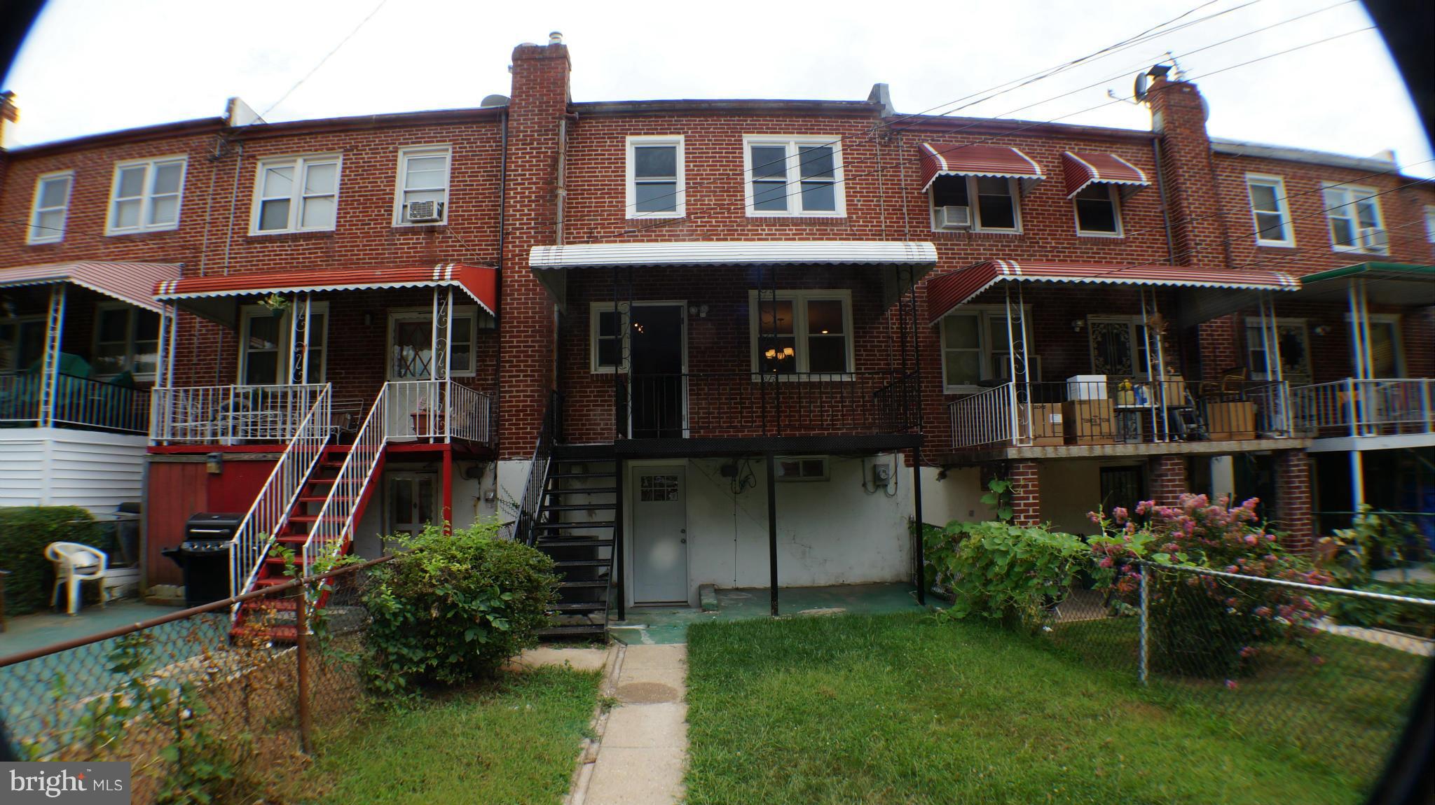 1233 Kevin Road Baltimore, MD 21229 - Photo 17 of 22 a front view of a house with a yard
