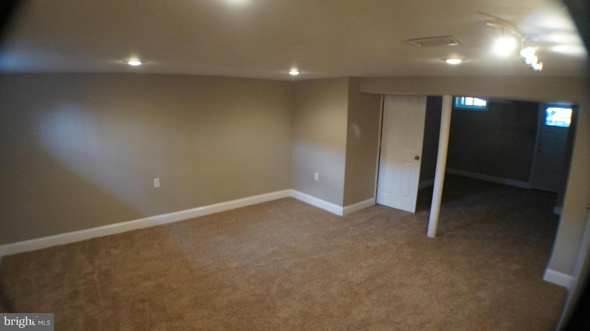 1233 Kevin Road Baltimore, MD 21229 - Photo 9 of 22 an empty room with closet and windows