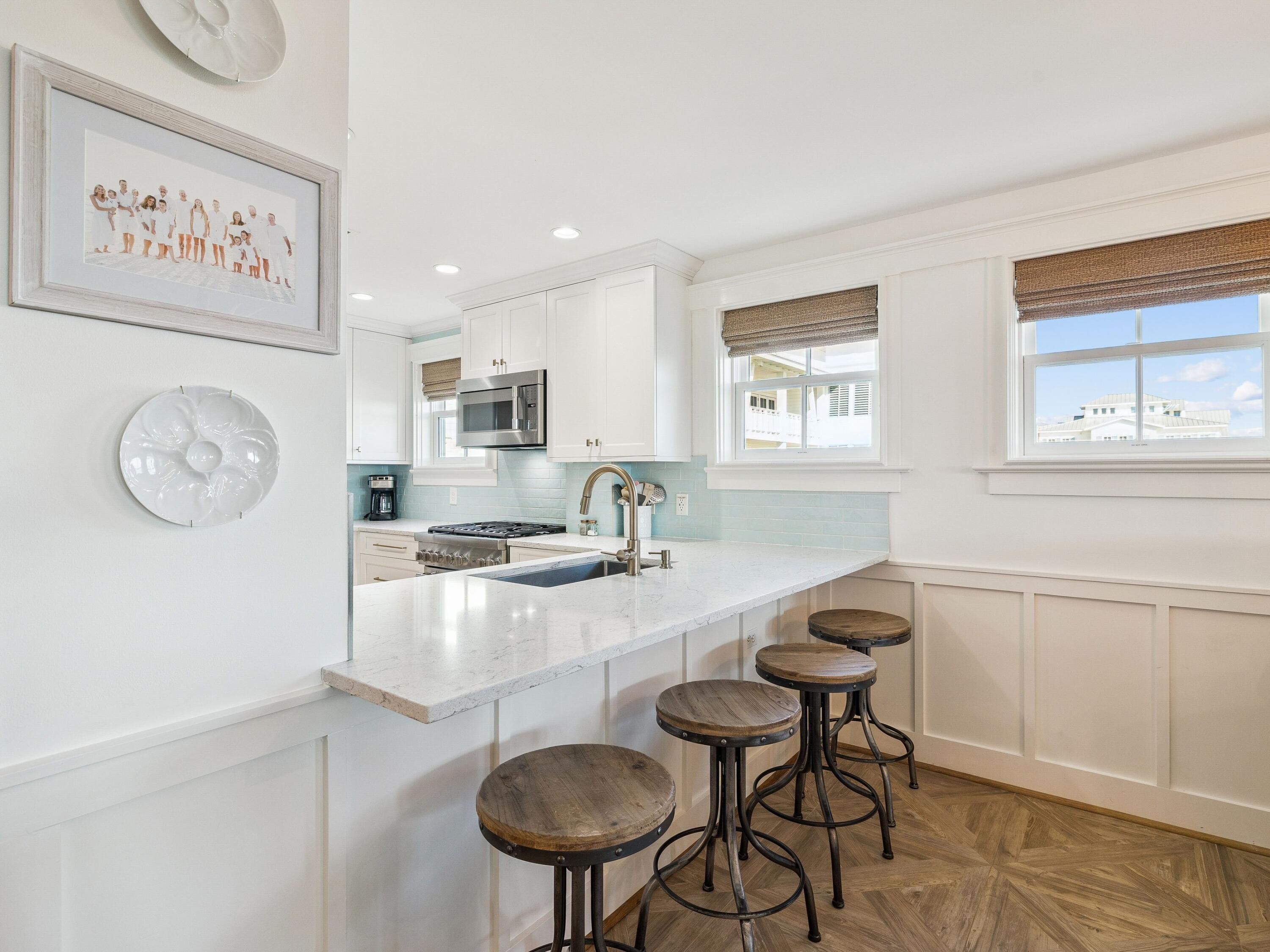 1848 East County Highway 30A, Unit 2 Santa Rosa Beach, FL 32459 - Photo 26 of 37 a kitchen with stainless steel appliances granite countertop a sink and a stove