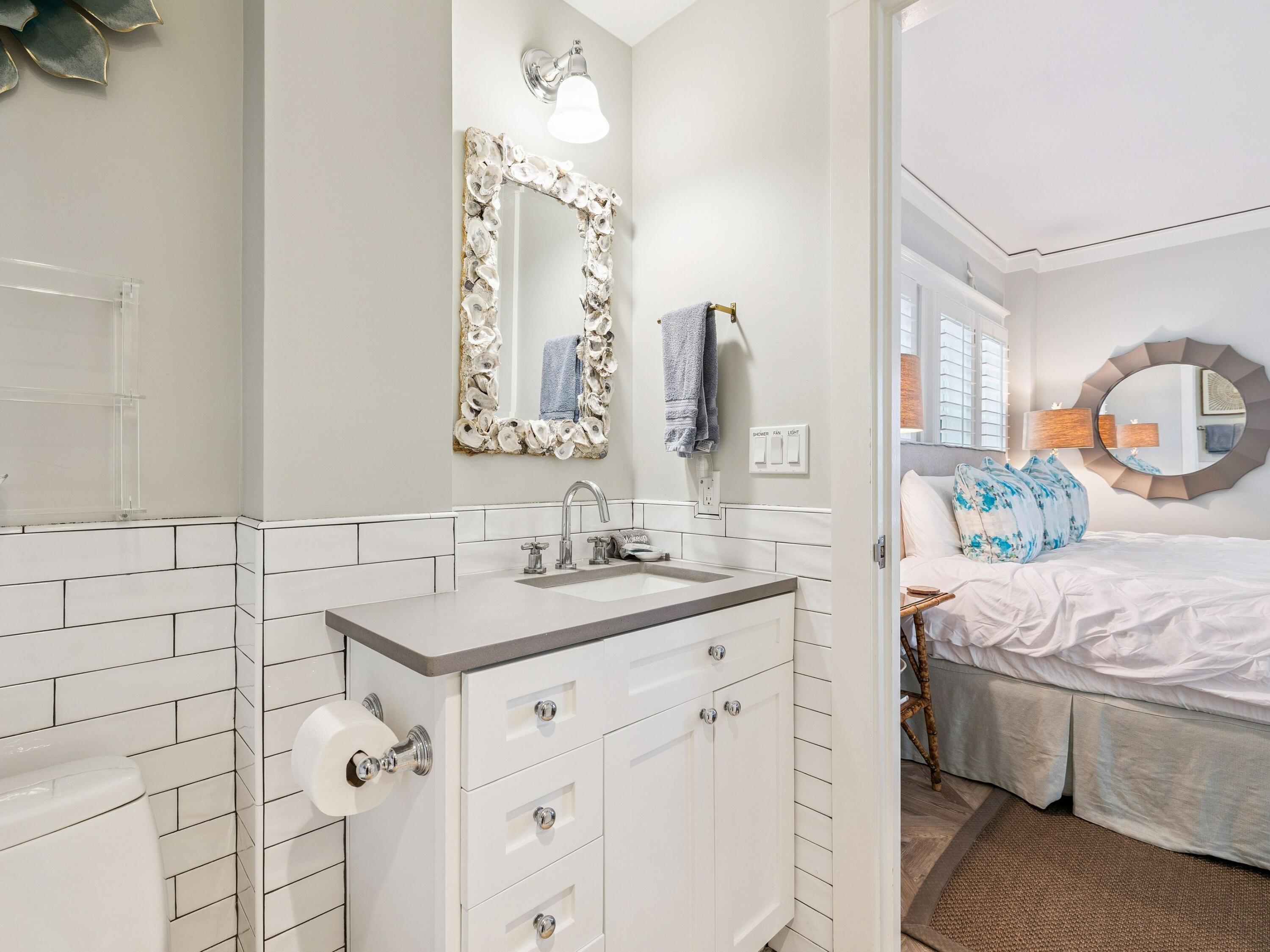 1848 East County Highway 30A, Unit 2 Santa Rosa Beach, FL 32459 - Photo 29 of 37 a bathroom with a sink and a mirror