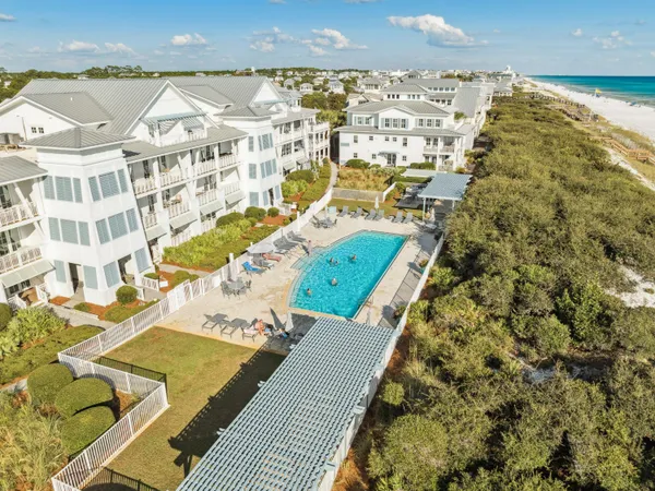 an aerial view of residential houses with outdoor space