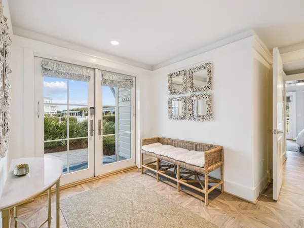 a bedroom with furniture and a window