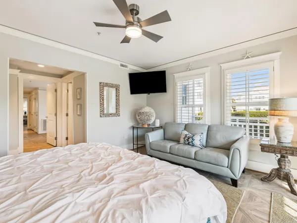 a bedroom with a large bed and a couch