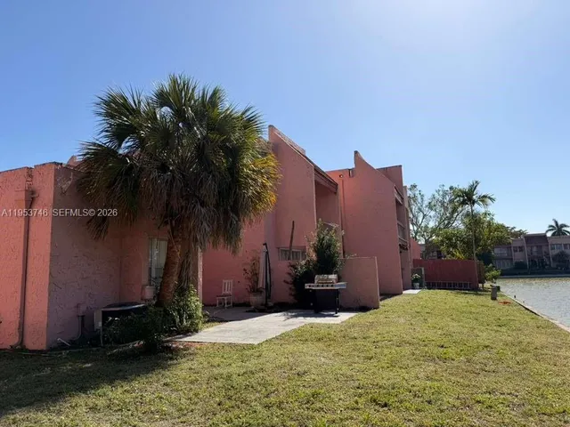 a view of a lake with a palm trees