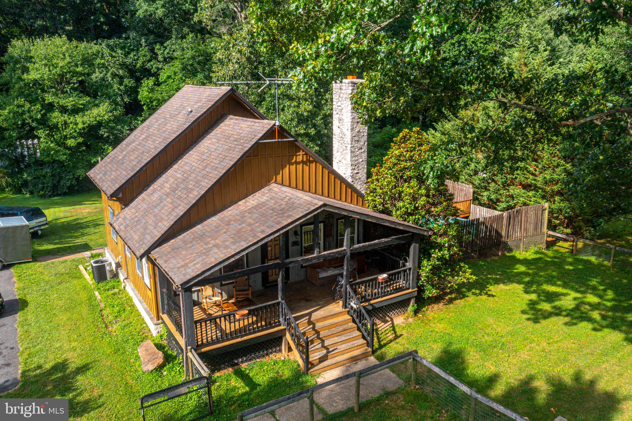 10 Clubhouse Road Delta, PA 17314 - Photo 62 of 70 Charming cabin nestled in lush greenery.
