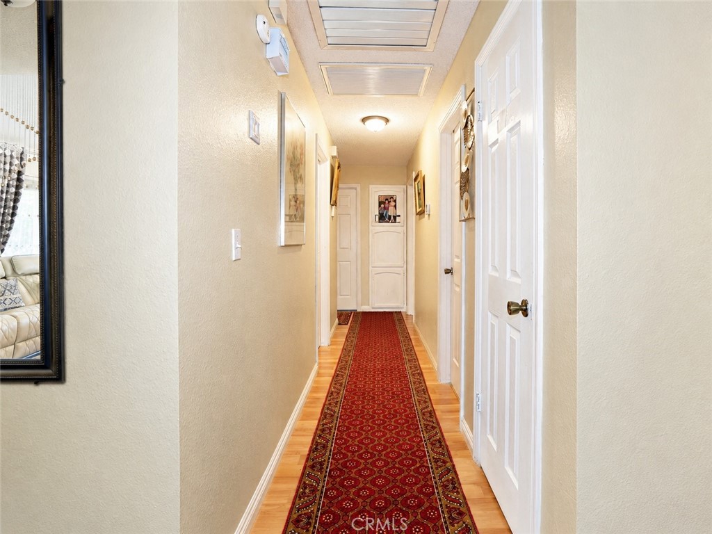 4100 Ahwahnee Court Modesto, CA 95356 - Photo 20 of 34 Bright hallway connecting the home’s bedrooms and living spaces.