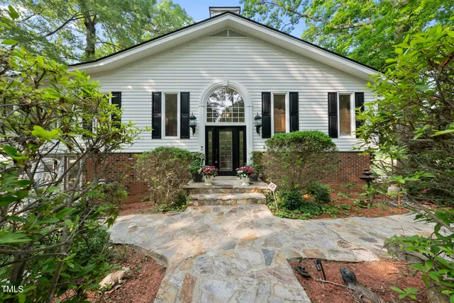 a bedroom with bed and window