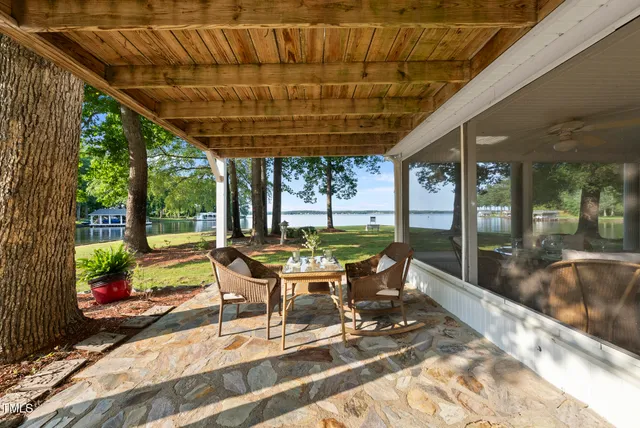 a bedroom with furniture and wooden floor