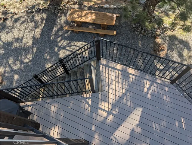 a view of balcony with wooden floor