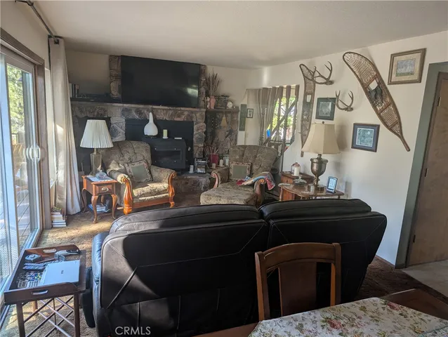 a room with a table chairs and entryway