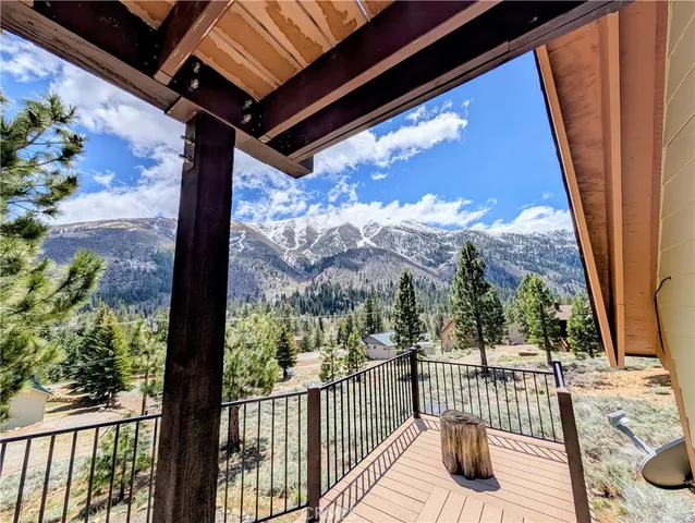 a view of a two chairs in the balcony