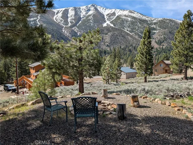 a view of a backyard with sitting area