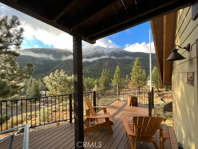 a view of a balcony with chairs