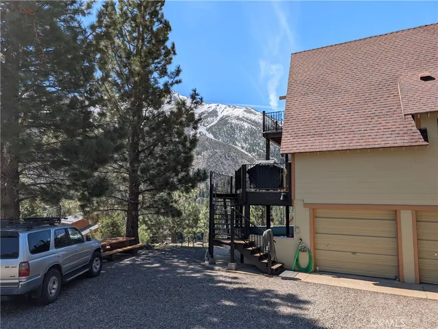 a view of a car park in front of house
