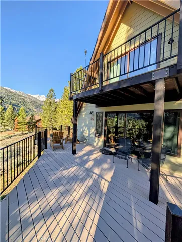 a view of a house with wooden deck