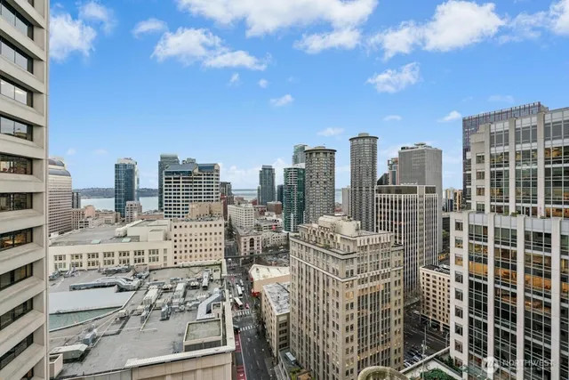 a view of city with tall buildings