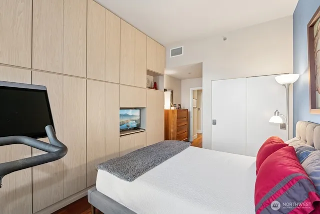 a bedroom with a bed and a fireplace