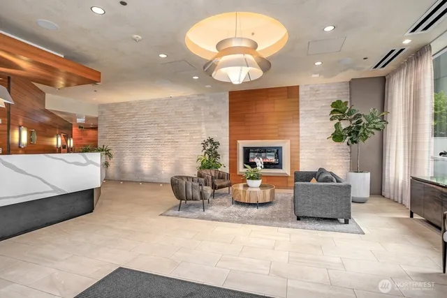 a living room with furniture and a large window