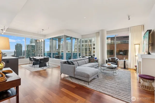 a living room with furniture and a large window
