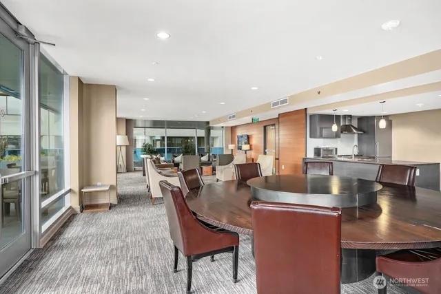 a living room with fireplace furniture and a large window