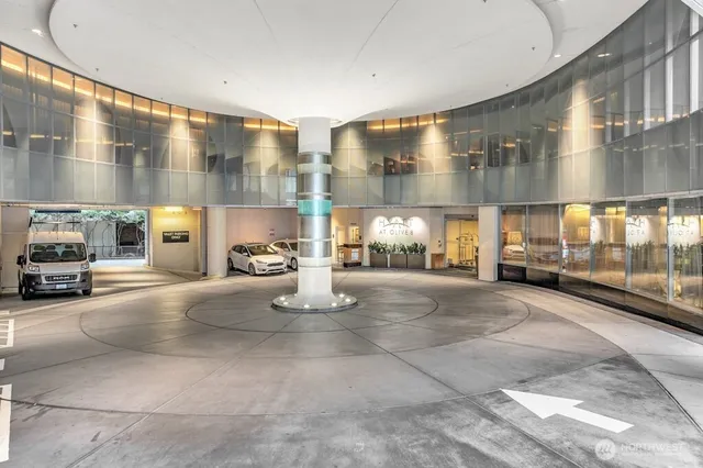 a room with lots of chairs and mirrors