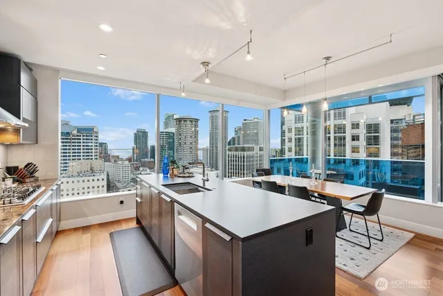 a very nice looking living room with a large window and furniture