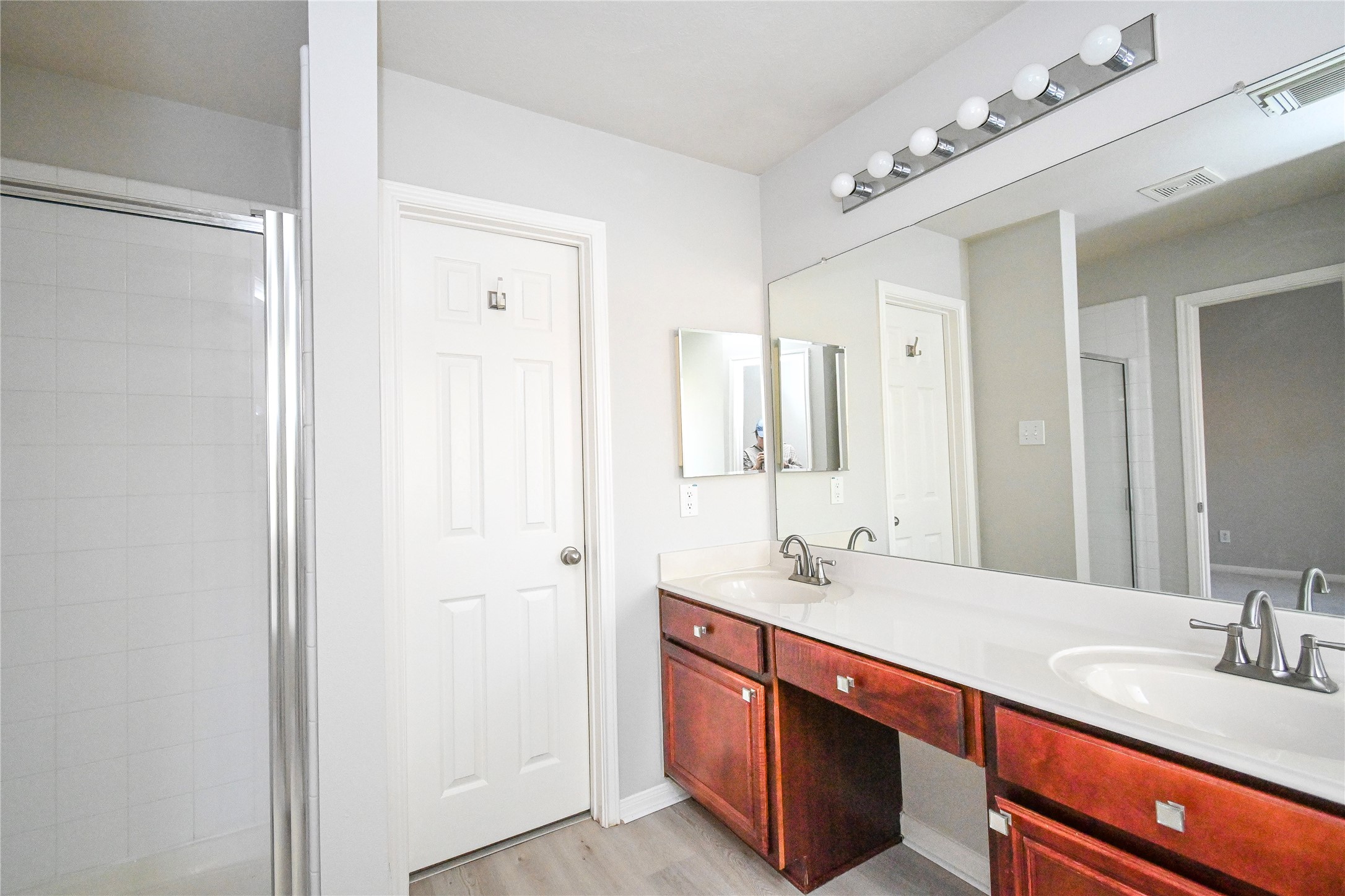 3111 Myrtle Ranch Drive Katy, TX 77494 - Photo 21 of 27 a bathroom with double vanity sink and a mirror