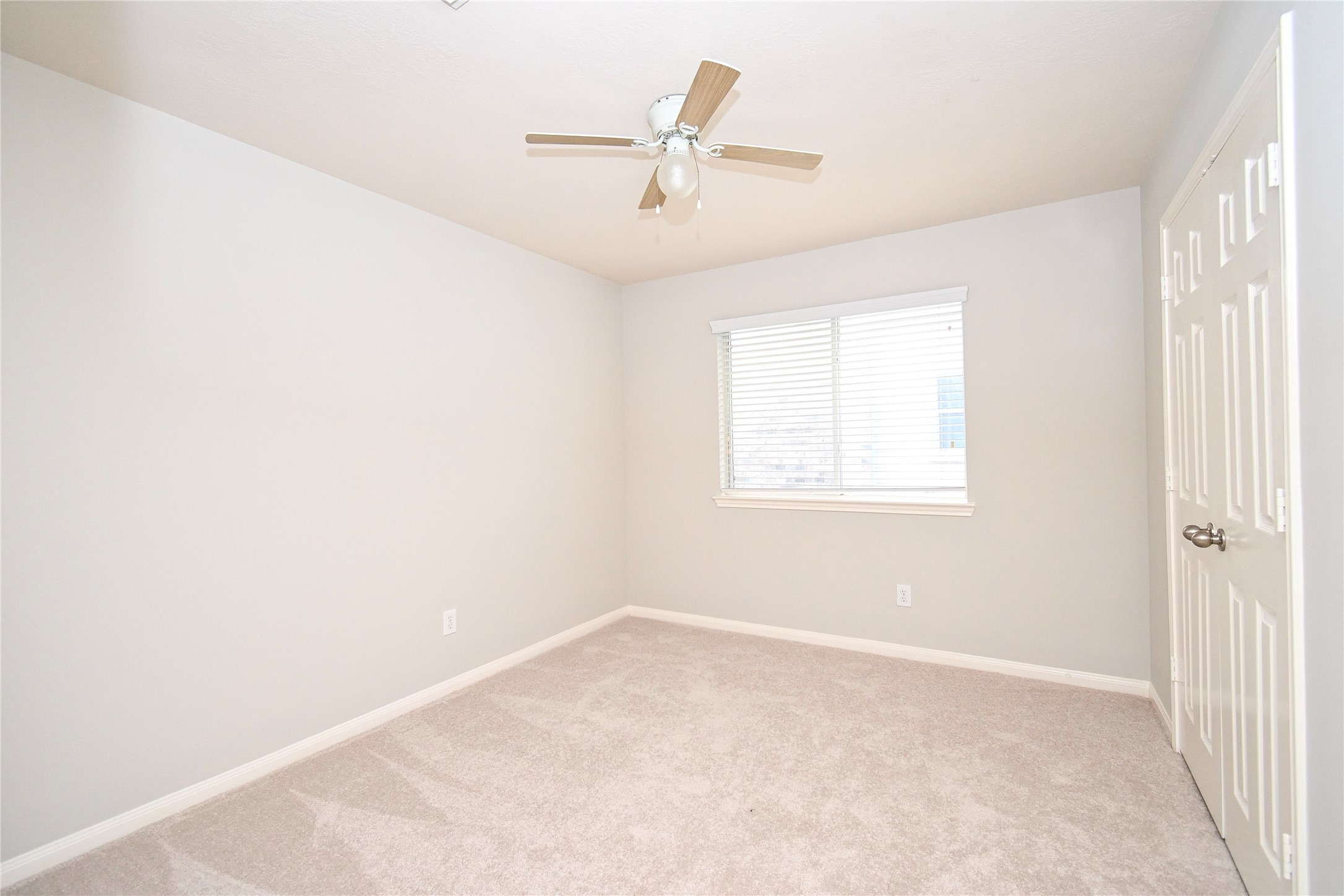 3111 Myrtle Ranch Drive Katy, TX 77494 - Photo 24 of 27 an empty room with a window and a fan