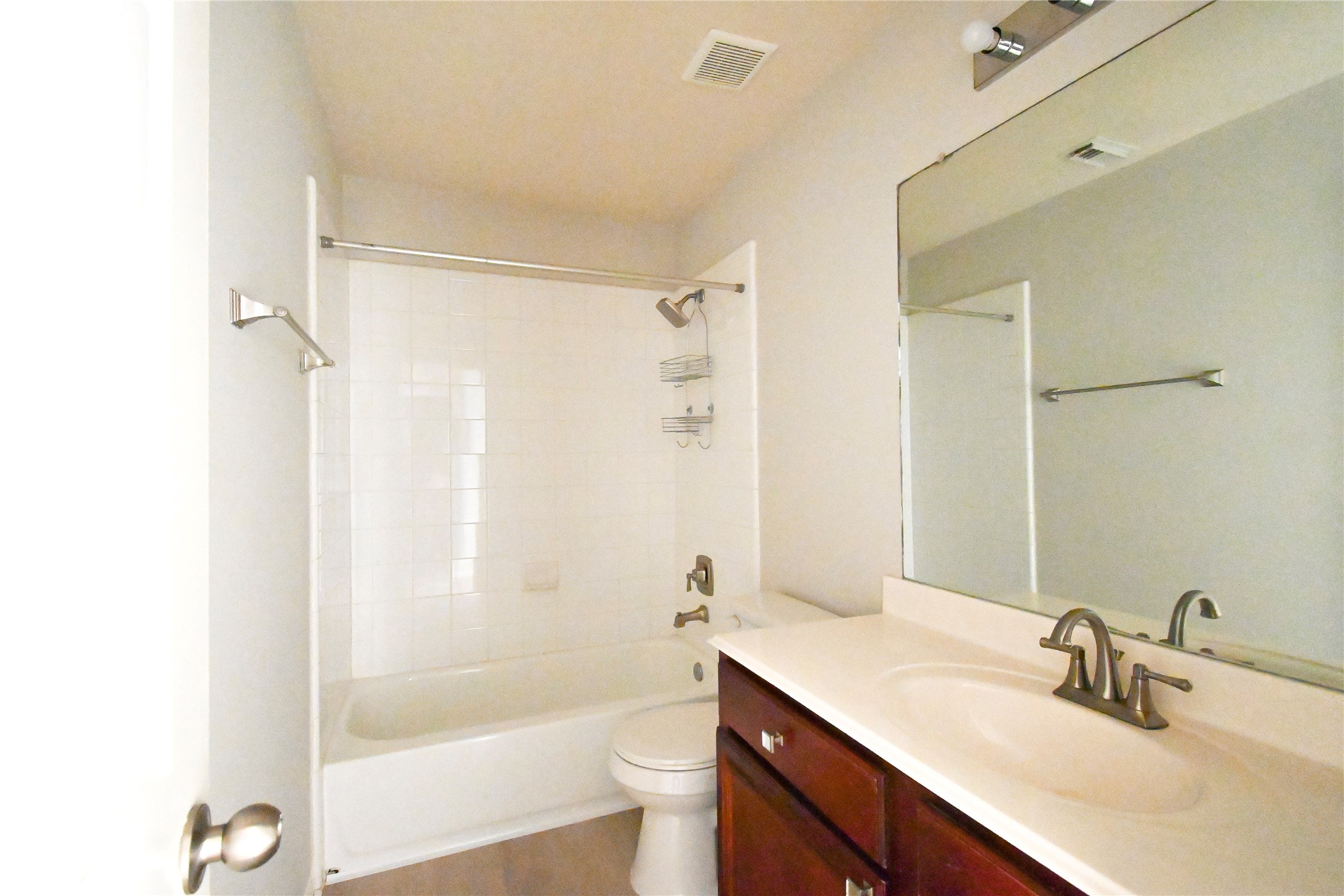 3111 Myrtle Ranch Drive Katy, TX 77494 - Photo 25 of 27 a bathroom with a sink a toilet a mirror a bathtub and shower