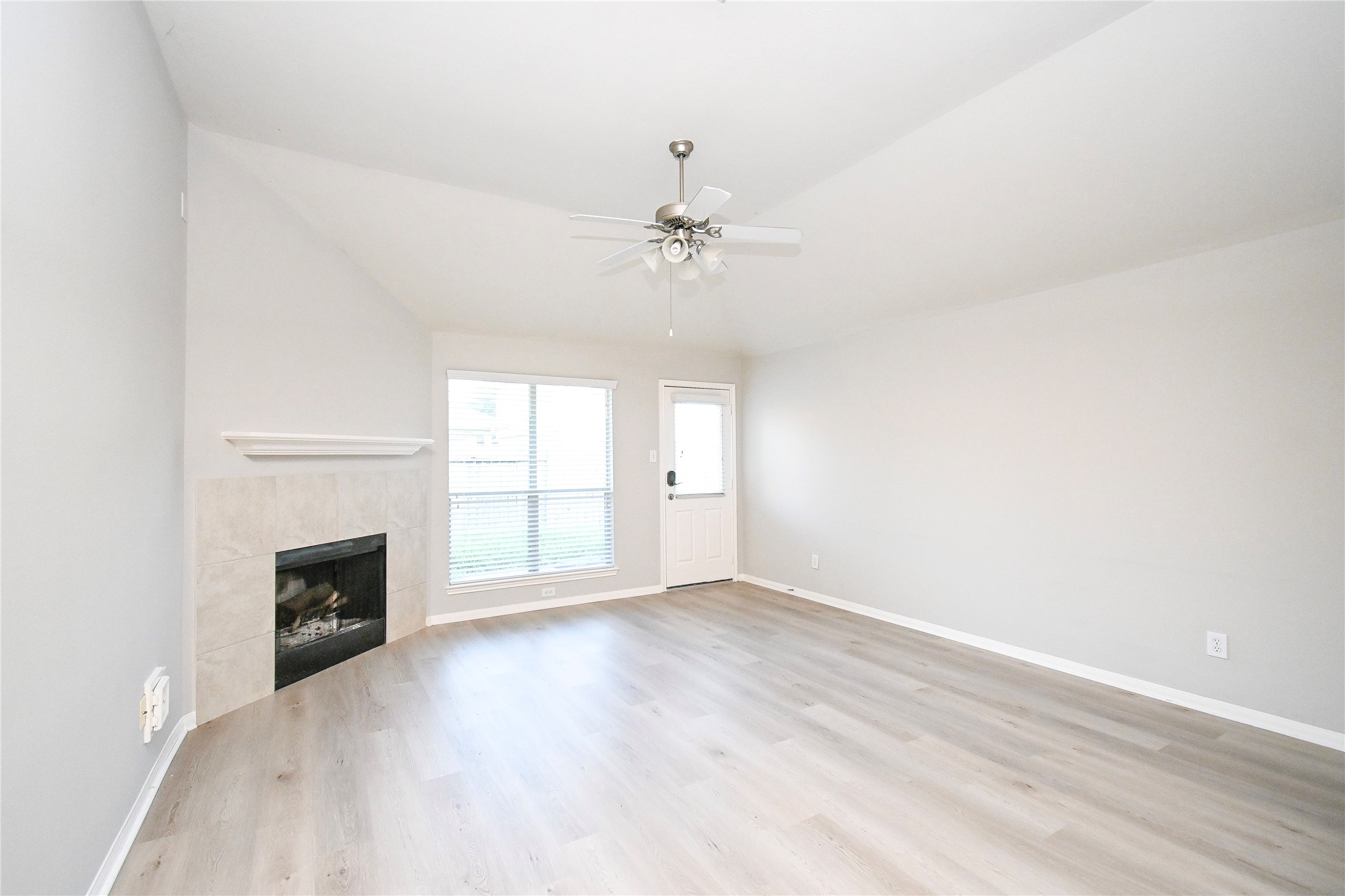 3111 Myrtle Ranch Drive Katy, TX 77494 - Photo 10 of 27 an empty room with windows and fireplace
