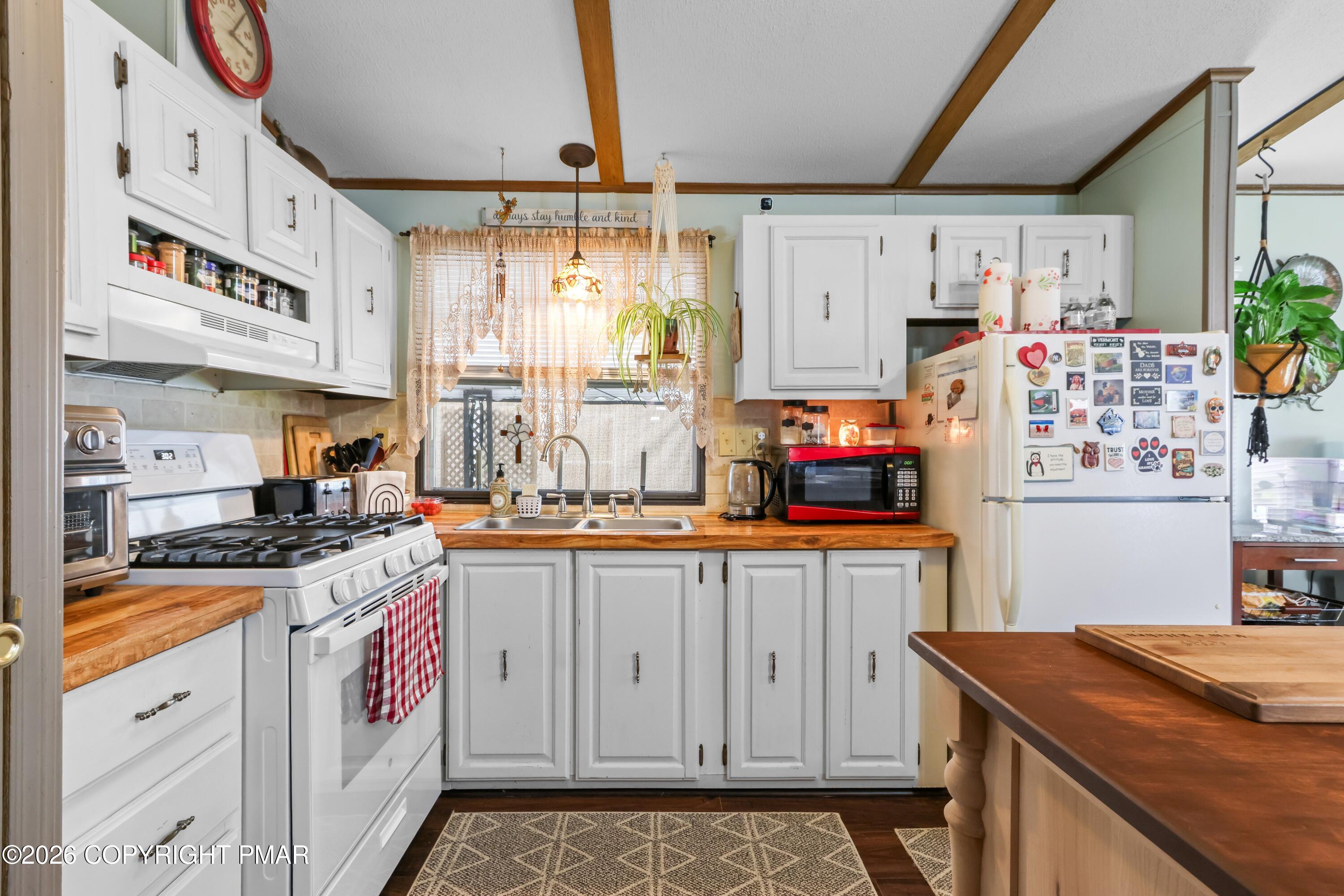 17 Valley View Drive Bath, PA 18014 - Photo 12 of 34 a kitchen with stainless steel appliances granite countertop a stove a sink and a refrigerator