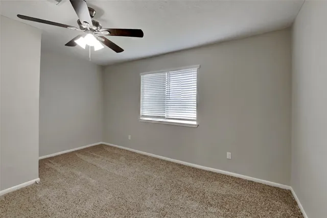 an empty room with closet area