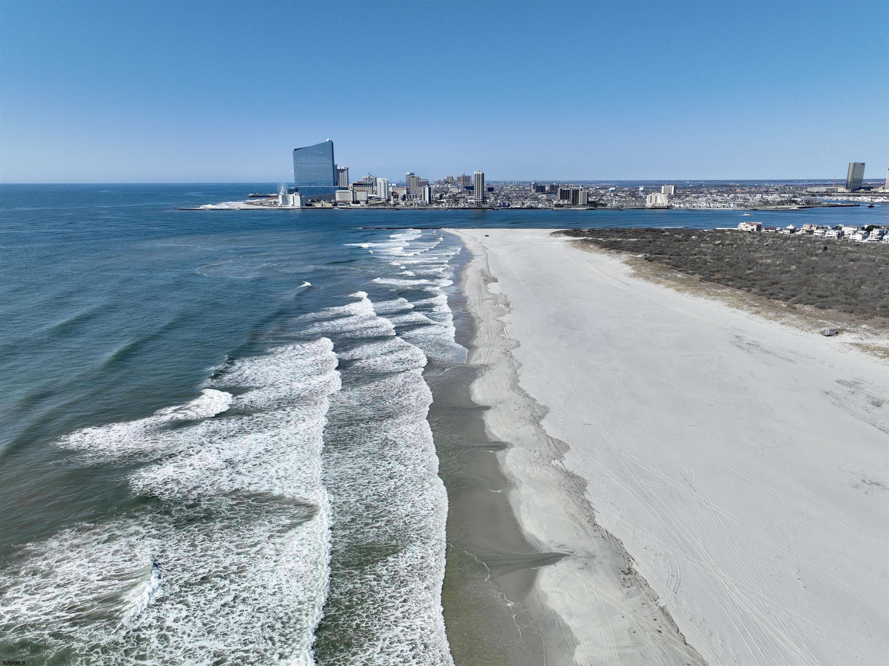39 Beacon Lane Brigantine, NJ 08203 - Photo 13 of 14 a view of a lake with a mountain in the background