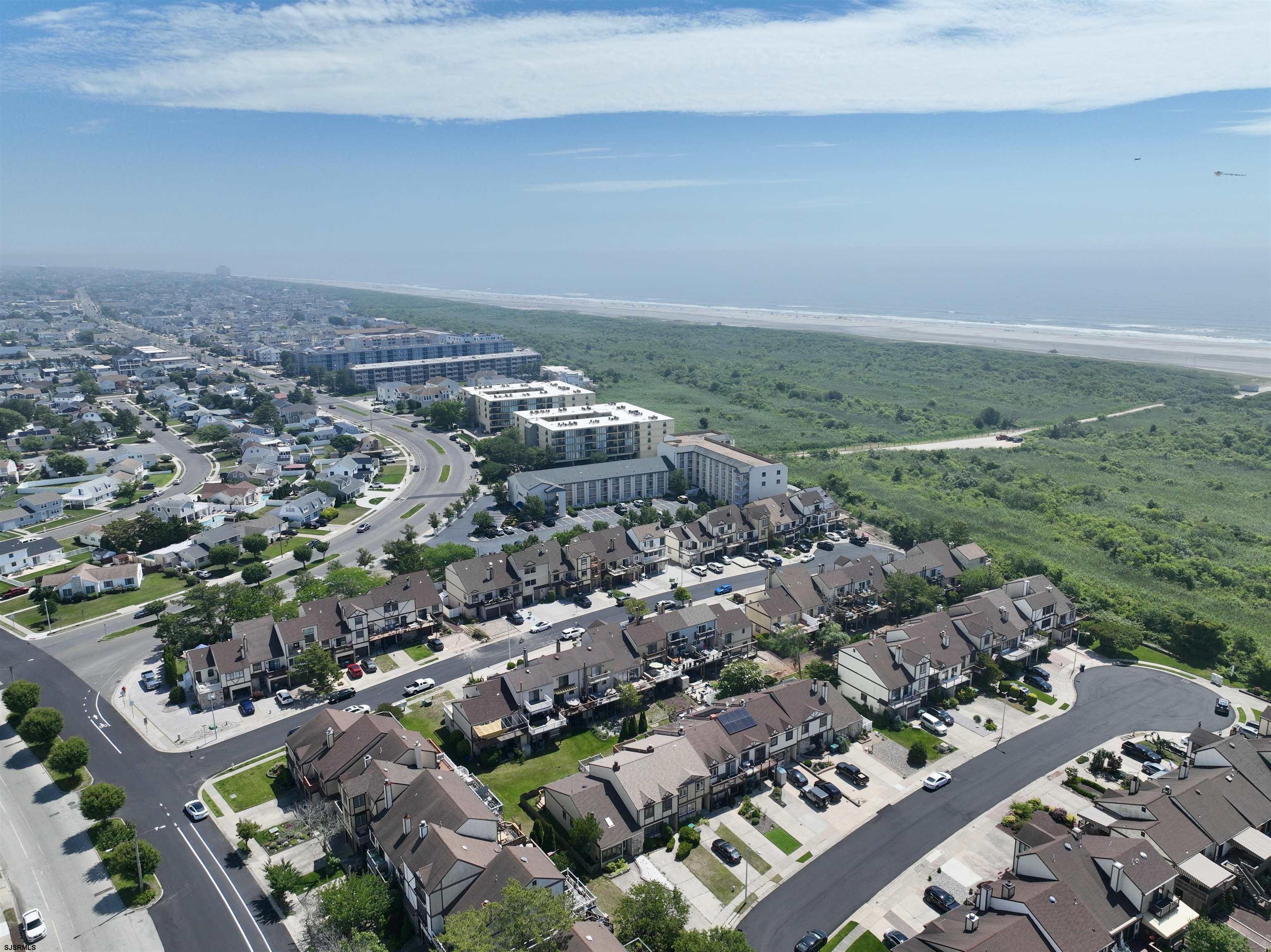 39 Beacon Lane Brigantine, NJ 08203 - Photo 3 of 14 an aerial view of a city with lots of residential buildings