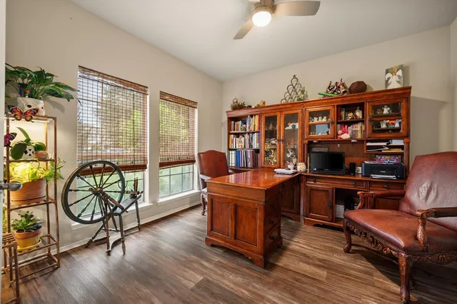 a dining room with furniture and wooden floor