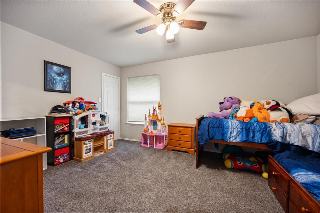 308 Faith Court Burleson, TX 76028 - Photo 23 of 40 a bedroom with furniture and a bed