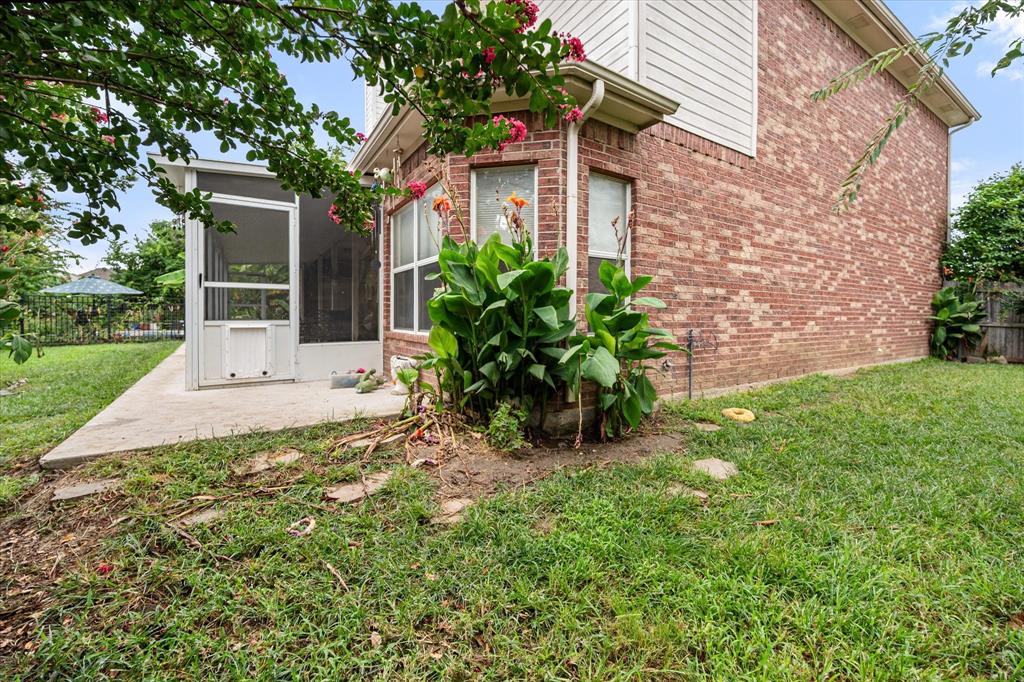 308 Faith Court Burleson, TX 76028 - Photo 32 of 40 a front view of a house with a yard and potted plants